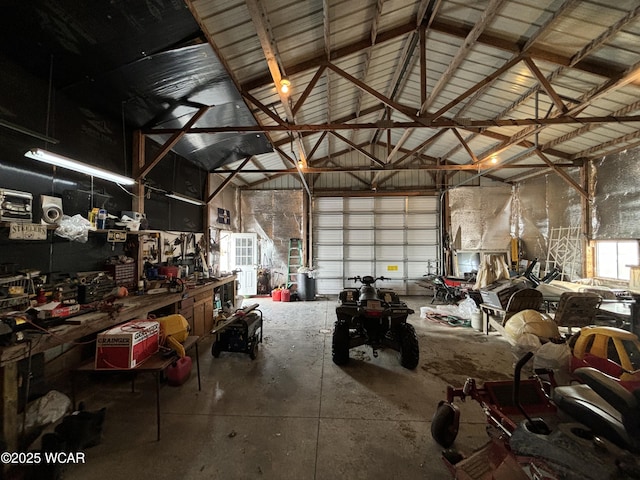 garage featuring metal wall and a workshop area