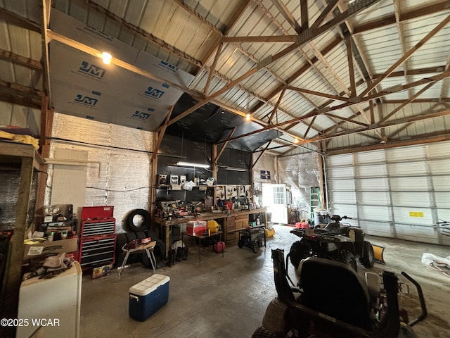 garage featuring metal wall and a workshop area
