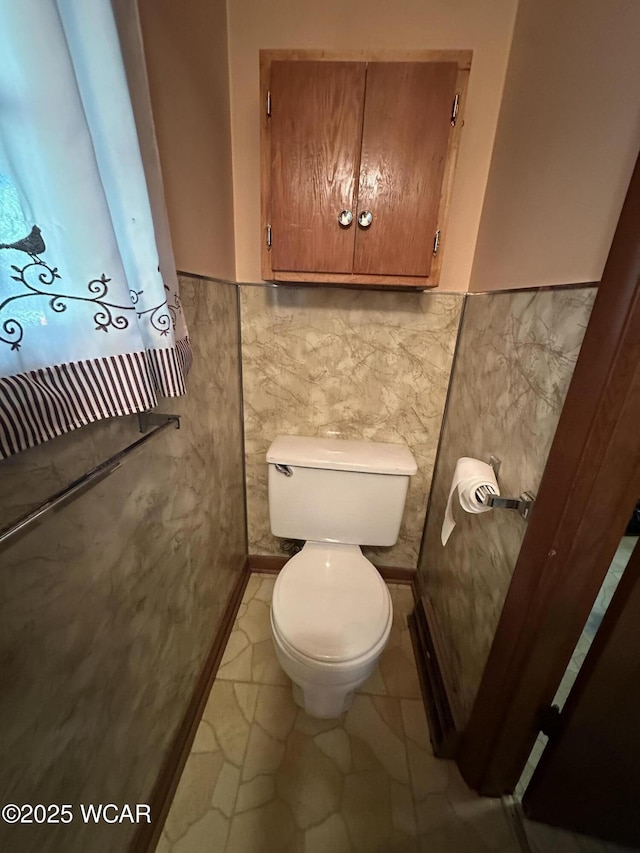 1115 Fett Ave, Lima, OH 45801 - bathroom with toilet, tile walls, and wainscoting