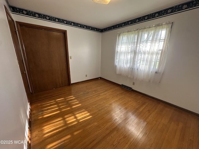 1115 Fett Ave, Lima, OH 45801 - empty room featuring hardwood / wood-style flooring and baseboards