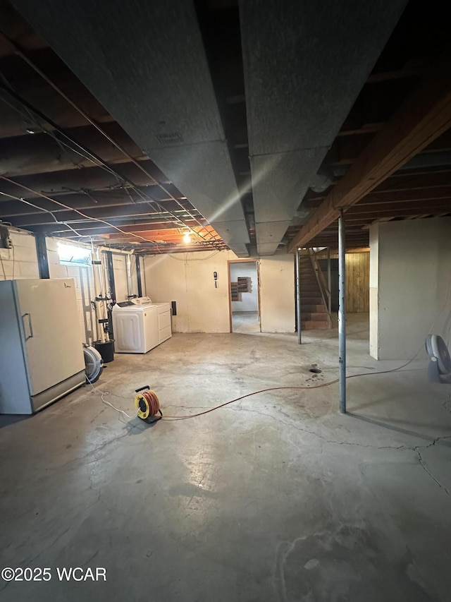 1115 Fett Ave, Lima, OH 45801 - unfinished basement with separate washer and dryer, freestanding refrigerator, and stairway