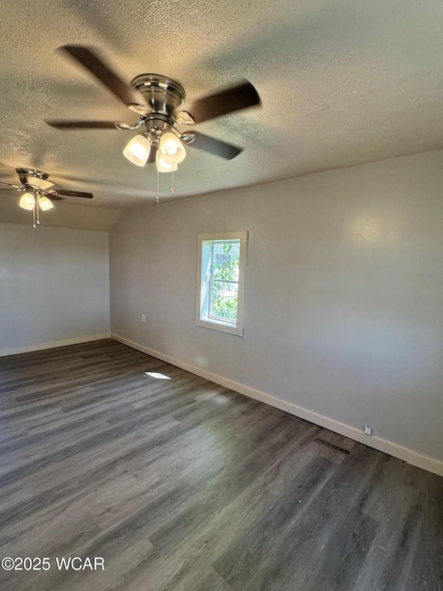 138 Letson Ave, Kenton, OH 43326 - unfurnished room with a textured ceiling, a ceiling fan, dark wood-style floors, and baseboards