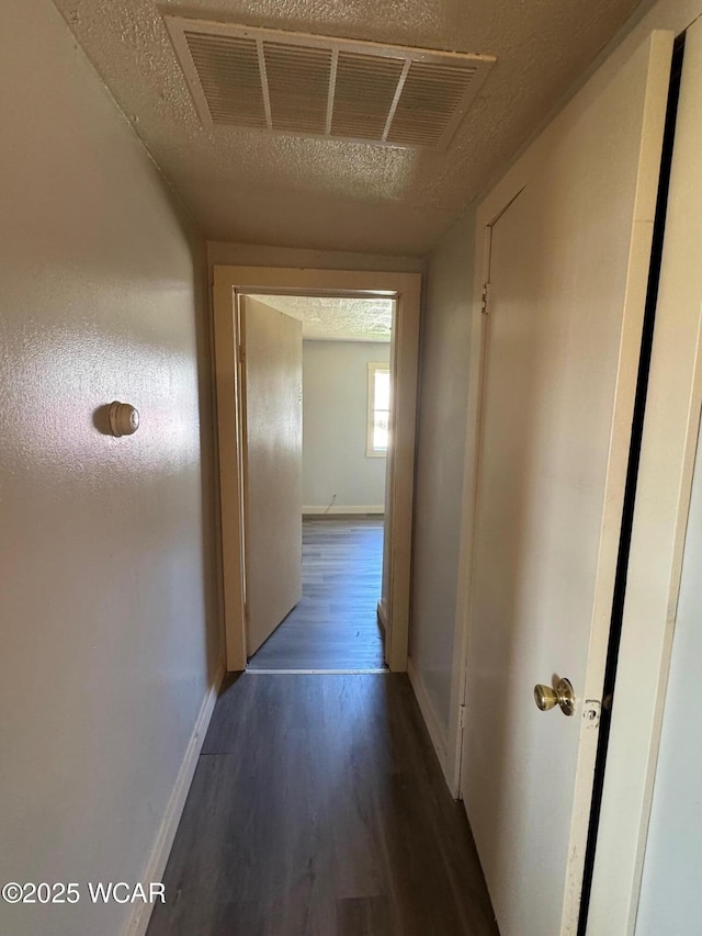 138 Letson Ave, Kenton, OH 43326 - corridor with wood finished floors, baseboards, and a textured ceiling