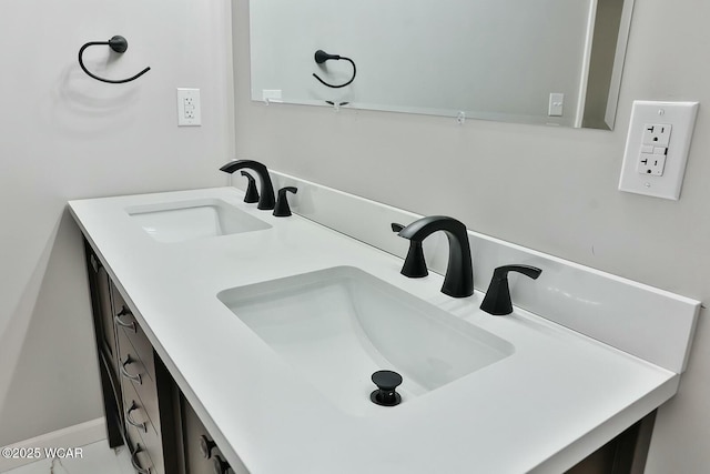bathroom featuring double vanity and a sink