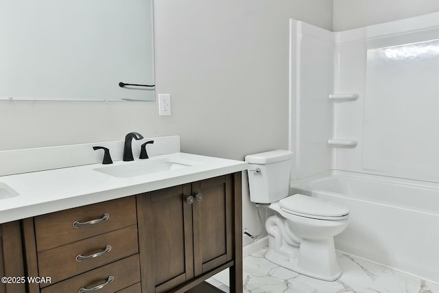 bathroom featuring marble finish floor, vanity, toilet, and bathtub / shower combination