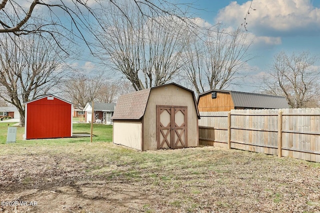 view of shed featuring fence