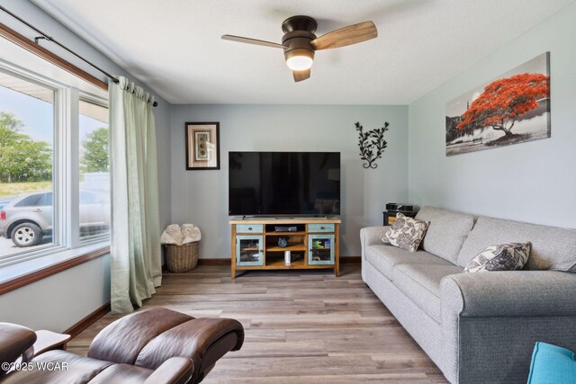 2855 State Route 67, Belle Center, OH 43310 - living area with ceiling fan, wood finished floors, and baseboards