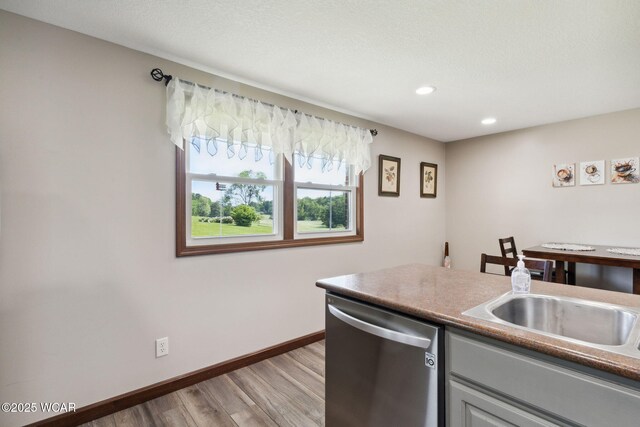 2855 State Route 67, Belle Center, OH 43310 - kitchen with dishwasher, light wood-type flooring, baseboards, recessed lighting, and a sink