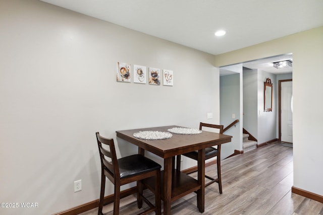 2855 State Route 67, Belle Center, OH 43310 - dining area with light wood finished floors, stairway, baseboards, and recessed lighting