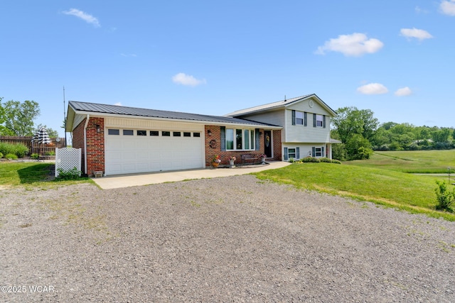 2855 State Route 67, Belle Center, OH 43310 - split level home with driveway, an attached garage, brick siding, and metal roof
