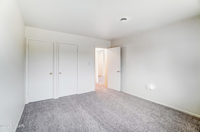 unfurnished bedroom featuring carpet