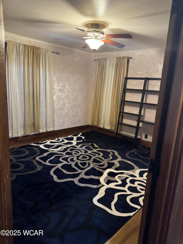 unfurnished bedroom with ornamental molding and ceiling fan