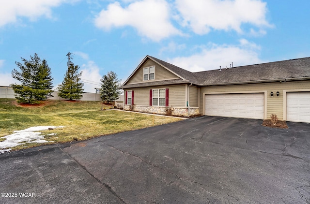 view of front facade with a garage and a front yard