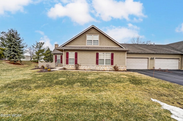 view of front of home with a garage and a front yard