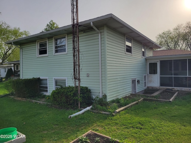 806 N Canal St, Delphos, OH 45833 - view of side of home featuring a yard and a sunroom