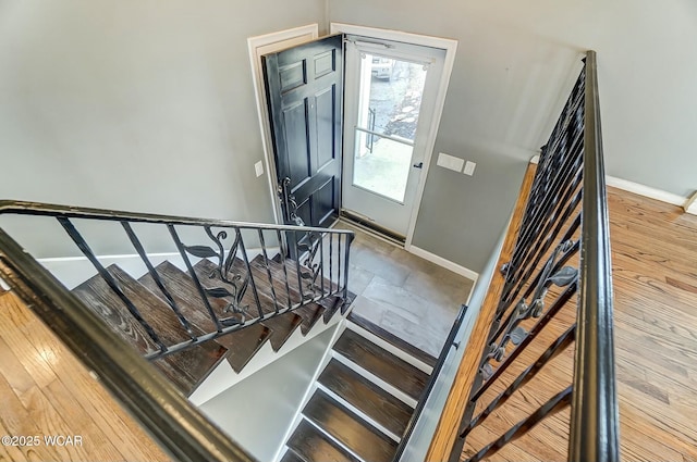 staircase featuring baseboards