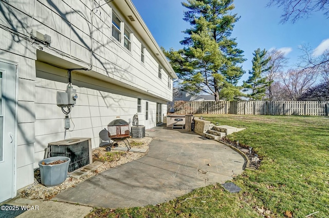 exterior space with central air condition unit, a patio area, and fence