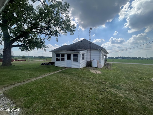 2845 Greely Chapel Rd, Lima, OH 45806 - back of property with a lawn and roof with shingles