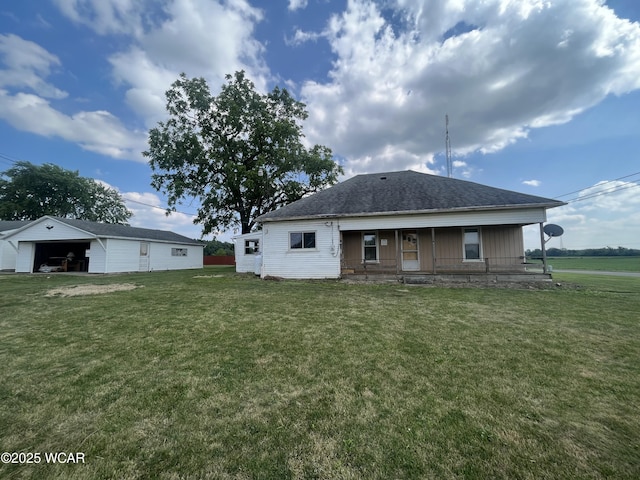 2845 Greely Chapel Rd, Lima, OH 45806 - rear view of property featuring a yard, covered porch, and a detached garage