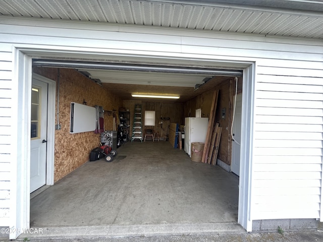 2845 Greely Chapel Rd, Lima, OH 45806 - garage featuring freestanding refrigerator