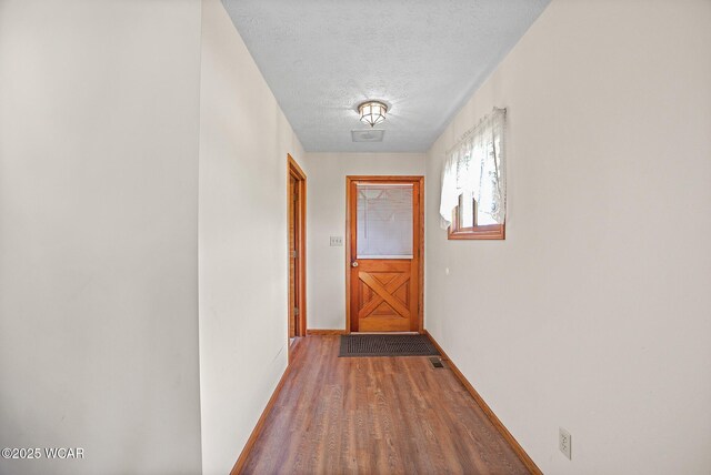 18509 State Highway 67, Upper Sandusky, OH 43351 - hallway with wood finished floors and a textured ceiling