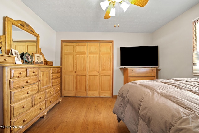 18509 State Highway 67, Upper Sandusky, OH 43351 - bedroom with light wood-style flooring, a closet, and a ceiling fan