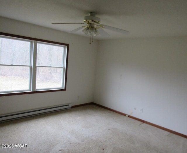 empty room featuring a baseboard radiator, baseboards, ceiling fan, and carpet flooring