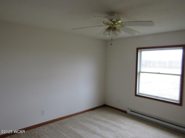 unfurnished room with a baseboard radiator, baseboards, light carpet, and a ceiling fan