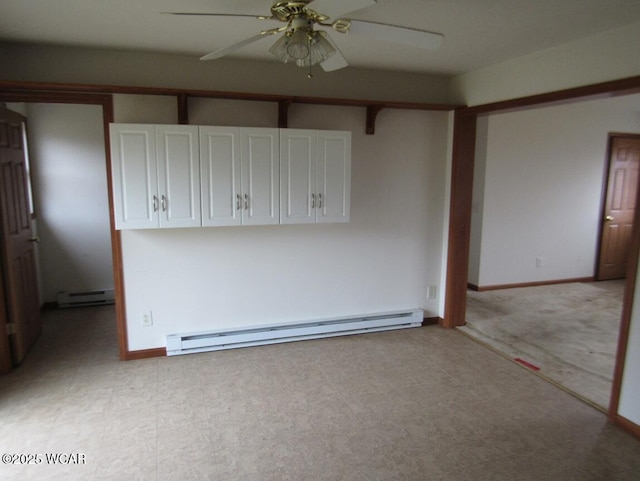 unfurnished room featuring a ceiling fan, baseboards, baseboard heating, and a baseboard radiator