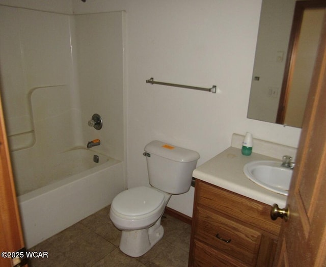 bathroom with tile patterned flooring, baseboards, toilet, shower / tub combination, and vanity