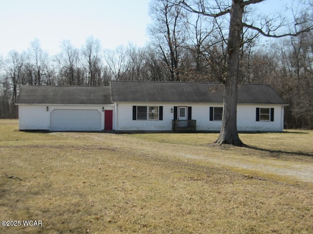 ranch-style house featuring dirt driveway, a front lawn, and an attached garage