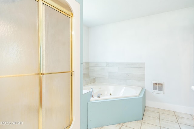 full bathroom with tile patterned floors, a stall shower, baseboards, heating unit, and a tub with jets