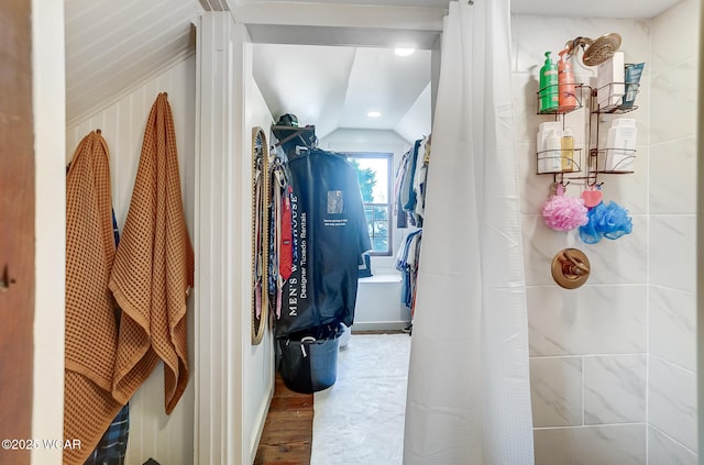 walk in closet featuring lofted ceiling and hardwood / wood-style floors