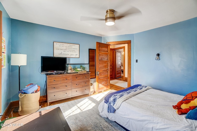 bedroom featuring ceiling fan and light wood-type flooring