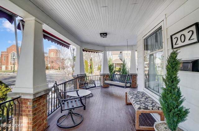 wooden deck with a porch