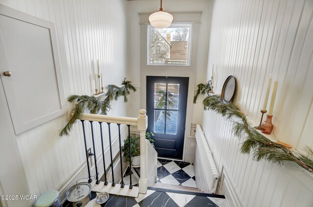 foyer featuring plenty of natural light