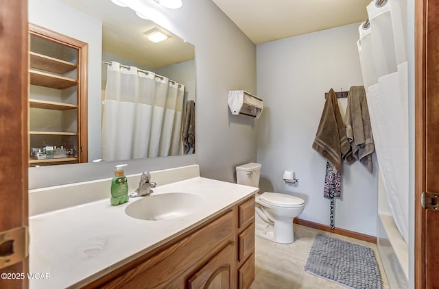 bathroom with tile patterned floors, vanity, and toilet