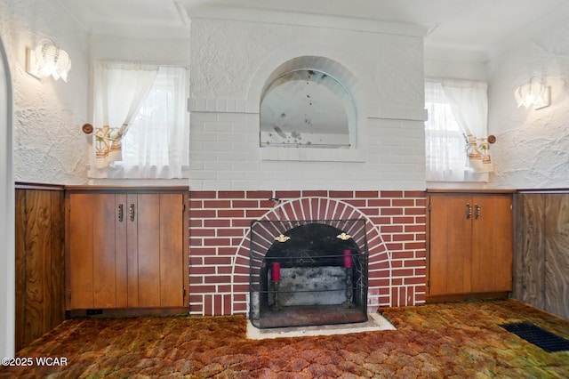 635 Close Ave, Lima, OH 45805 - unfurnished living room featuring a textured wall, visible vents, and a fireplace