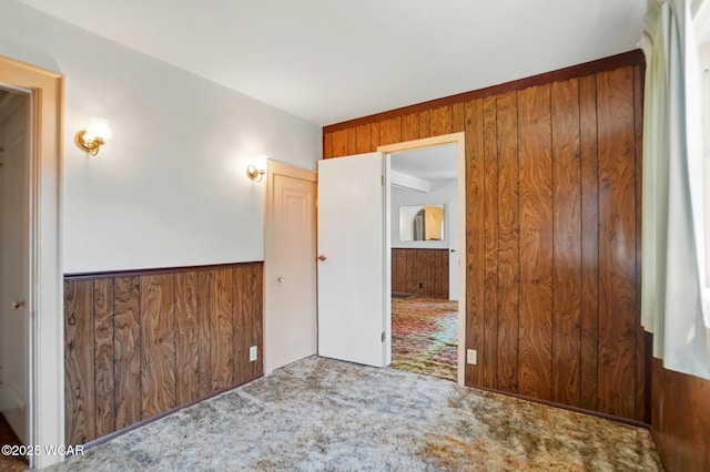 635 Close Ave, Lima, OH 45805 - carpeted spare room featuring wood walls