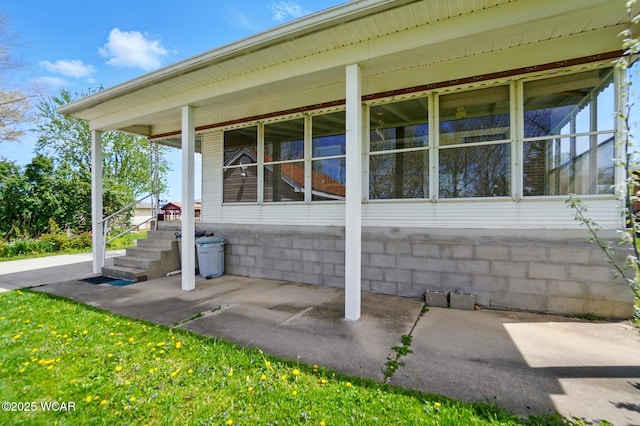 635 Close Ave, Lima, OH 45805 - view of side of home with a sunroom and covered porch