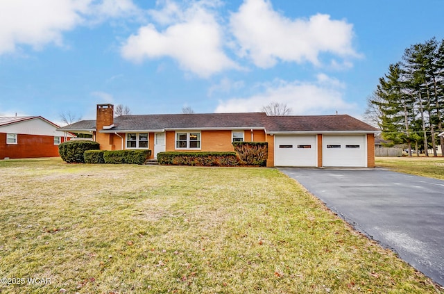 ranch-style house featuring a garage, driveway, a chimney, and a front lawn