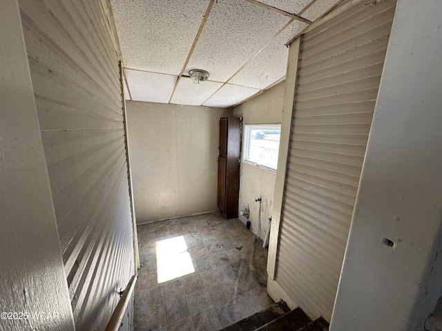 corridor featuring a drop ceiling