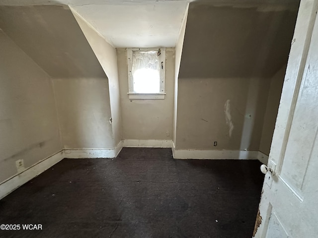 bonus room featuring baseboards