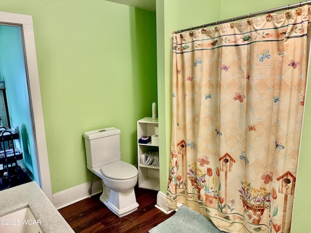 702 W Vine St, Lima, OH 45804 - full bath with wood finished floors, curtained shower, and vanity