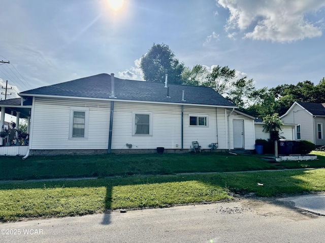 702 W Vine St, Lima, OH 45804 - view of home's exterior with entry steps and a yard