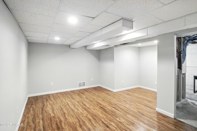 418 S Judkins Ave, Lima, OH 45805 - finished basement featuring wood finished floors, a drop ceiling, and recessed lighting