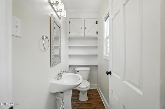 418 S Judkins Ave, Lima, OH 45805 - half bathroom featuring wood finished floors and crown molding