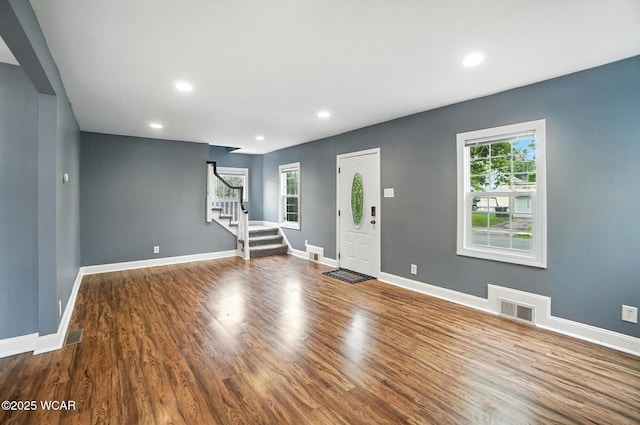 418 S Judkins Ave, Lima, OH 45805 - unfurnished living room with stairway, wood finished floors, and recessed lighting