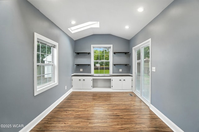 418 S Judkins Ave, Lima, OH 45805 - kitchen with open shelves, a skylight, dark wood-style floors, vaulted ceiling, and white cabinets