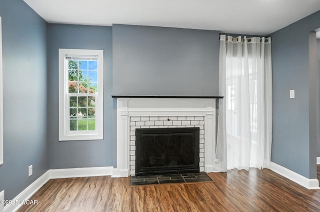 418 S Judkins Ave, Lima, OH 45805 - detailed view of wood finished floors and a brick fireplace